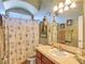 Bathroom boasts a shower/tub combo, decorative lighting, and ample vanity counter space at 1830 E Fuchsia St, Pahrump, NV 89048
