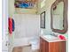 Cozy bathroom featuring shower, bathtub, and vanity with a decorative mirror at 1830 E Fuchsia St, Pahrump, NV 89048