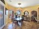 Inviting dining area with a chandelier, table, and natural light from the window at 1830 E Fuchsia St, Pahrump, NV 89048