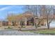 Desert home with an elegant water fountain, decorative statues, and circular driveway at 1830 E Fuchsia St, Pahrump, NV 89048