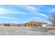 Spacious desert home featuring rock landscaping, ample parking, and mountain views at 1830 E Fuchsia St, Pahrump, NV 89048