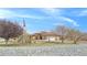 Traditional home featuring a beautiful lawn, large driveway, and flagpole with American flag at 1830 E Fuchsia St, Pahrump, NV 89048