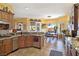 Well-appointed kitchen flowing to dining, featuring granite counters and stainless appliances at 1830 E Fuchsia St, Pahrump, NV 89048