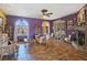 Spacious living room with fireplace, display cabinets, and comfortable seating at 1830 E Fuchsia St, Pahrump, NV 89048
