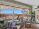 Inviting sunroom features comfortable seating and a view of the pool and backyard at 1830 E Fuchsia St, Pahrump, NV 89048