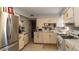 Well-lit kitchen featuring stainless steel appliances, light gray walls, and a combination of white cabinets at 1908 Hassett Ave, Las Vegas, NV 89104