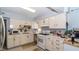 Functional kitchen with white cabinets, countertops, and appliances, perfect for culinary enthusiasts at 1908 Hassett Ave, Las Vegas, NV 89104