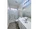 Bathroom featuring vanity, mirror, and shower/tub combo with glass doors at 2316 Cockatoo Dr, North Las Vegas, NV 89084