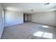 Spacious bonus room with plush carpet and recessed lighting at 2316 Cockatoo Dr, North Las Vegas, NV 89084