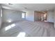 Large bonus room with plush carpet and access to staircase at 2316 Cockatoo Dr, North Las Vegas, NV 89084