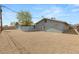 Exterior view featuring fenced gravel yard, providing both security and low-maintenance outdoor space at 2424 Statz St, North Las Vegas, NV 89030