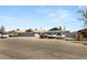 Street view of a multi-Gathering apartment building showing parking spaces for the units at 2424 Statz St, North Las Vegas, NV 89030
