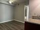 A well-lit bathroom features a granite counter, vanity and a peek at the bath and shower with similar finishing at 2451 N Rainbow Blvd # 1156, Las Vegas, NV 89108