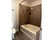 The bathroom features a bathtub and shower combo finished with granite-look paneling and a bronze shower head at 2451 N Rainbow Blvd # 1156, Las Vegas, NV 89108