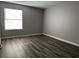 Cozy bedroom featuring hardwood floors and a window at 2451 N Rainbow Blvd # 1156, Las Vegas, NV 89108