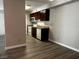 An open kitchen with dark wood cabinets and modern appliances at 2451 N Rainbow Blvd # 1156, Las Vegas, NV 89108