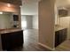 An open floor plan provides a view from the vanity to the living room and on to the kitchen area at 2451 N Rainbow Blvd # 1156, Las Vegas, NV 89108