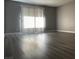 Bright living room featuring hardwood floors and a sliding glass door at 2451 N Rainbow Blvd # 1156, Las Vegas, NV 89108