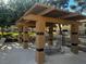A sheltered area provides lounge chairs and tables for residents to relax near the shared pool at 2451 N Rainbow Blvd # 1156, Las Vegas, NV 89108
