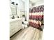Inviting bathroom with sleek vanity and a decorative shower curtain at 2508 Alfa Cir, Las Vegas, NV 89142