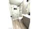Stylish bathroom features a shower with modern tile and neutral-tone vanity at 2508 Alfa Cir, Las Vegas, NV 89142