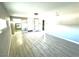 Spacious bedroom with new light gray paint, white trim and light wood laminate flooring at 2508 Alfa Cir, Las Vegas, NV 89142