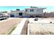 Charming two-story home featuring solar panels and a spacious front yard with a sitting area at 2508 Alfa Cir, Las Vegas, NV 89142