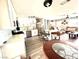 Bright, open kitchen featuring white cabinets, stainless appliances, and a breakfast bar at 2508 Alfa Cir, Las Vegas, NV 89142