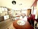 Bright, open kitchen featuring white cabinets, stainless appliances, and a breakfast bar at 2508 Alfa Cir, Las Vegas, NV 89142