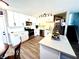 Modern kitchen featuring white cabinets, an island, and stainless steel appliances at 2508 Alfa Cir, Las Vegas, NV 89142