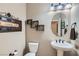 Charming half bathroom with stylish fixtures, decorative accents, and modern design at 262 Inflection St, Henderson, NV 89011