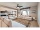 Cozy living room showcasing neutral furniture, an open layout, and seamless kitchen integration at 262 Inflection St, Henderson, NV 89011