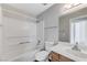 Bathroom with a shower and tub combination and a granite-look vanity that adds value to the property at 2621 Adelante Ave # 104, Las Vegas, NV 89106