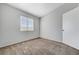 Neutral bedroom featuring carpet, a window, and a closet door that adds appeal at 2621 Adelante Ave # 104, Las Vegas, NV 89106