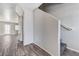 A bright entryway showcasing durable gray wood flooring and stairs leading to the upper level at 2621 Adelante Ave # 104, Las Vegas, NV 89106