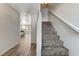 Hallway with hard flooring leading to stairs with carpeted steps at 2621 Adelante Ave # 104, Las Vegas, NV 89106
