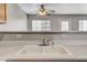 Bright kitchen featuring a double basin sink and a view of the dining area at 2621 Adelante Ave # 104, Las Vegas, NV 89106