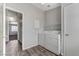 Laundry room equipped with modern appliances, shelving, and access to other areas of the house at 2621 Adelante Ave # 104, Las Vegas, NV 89106