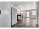 Open living area with wood floors, modern lighting, and a door leading to the outside at 2621 Adelante Ave # 104, Las Vegas, NV 89106