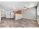 Spacious living area with modern wood floors, recessed lighting, and an open layout at 2621 Adelante Ave # 104, Las Vegas, NV 89106
