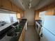 Kitchen features light colored cabinetry, tile floors, and a pass-through to the living area at 2845 Loveland Dr # 3616, Las Vegas, NV 89109