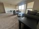 Living room view featuring carpet floors and balcony access at 2845 Loveland Dr # 3616, Las Vegas, NV 89109