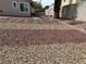 Low maintenance backyard featuring decorative rock landscaping and mature palm tree at 3316 Cutty Sark St, Las Vegas, NV 89117
