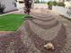 Low maintenance backyard with decorative rock landscaping and artificial turf at 3316 Cutty Sark St, Las Vegas, NV 89117