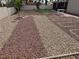 Large backyard with decorative rock and artificial turf landscaping at 3316 Cutty Sark St, Las Vegas, NV 89117