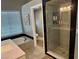 Modern bathroom featuring a soaking tub and a tiled walk-in shower at 3316 Cutty Sark St, Las Vegas, NV 89117