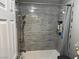 Bathroom with gray tile shower, brushed nickel hardware, and matching neutral decor at 3316 Cutty Sark St, Las Vegas, NV 89117