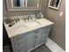Bathroom vanity with marble top, grey painted cabinets and brushed nickel hardware at 3316 Cutty Sark St, Las Vegas, NV 89117