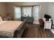 Bright bedroom with a luxury bed, work station, and natural light at 3316 Cutty Sark St, Las Vegas, NV 89117