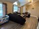 Elegant living room with high ceilings, decorative curtains, hardwood floors, and upscale furnishings at 3316 Cutty Sark St, Las Vegas, NV 89117